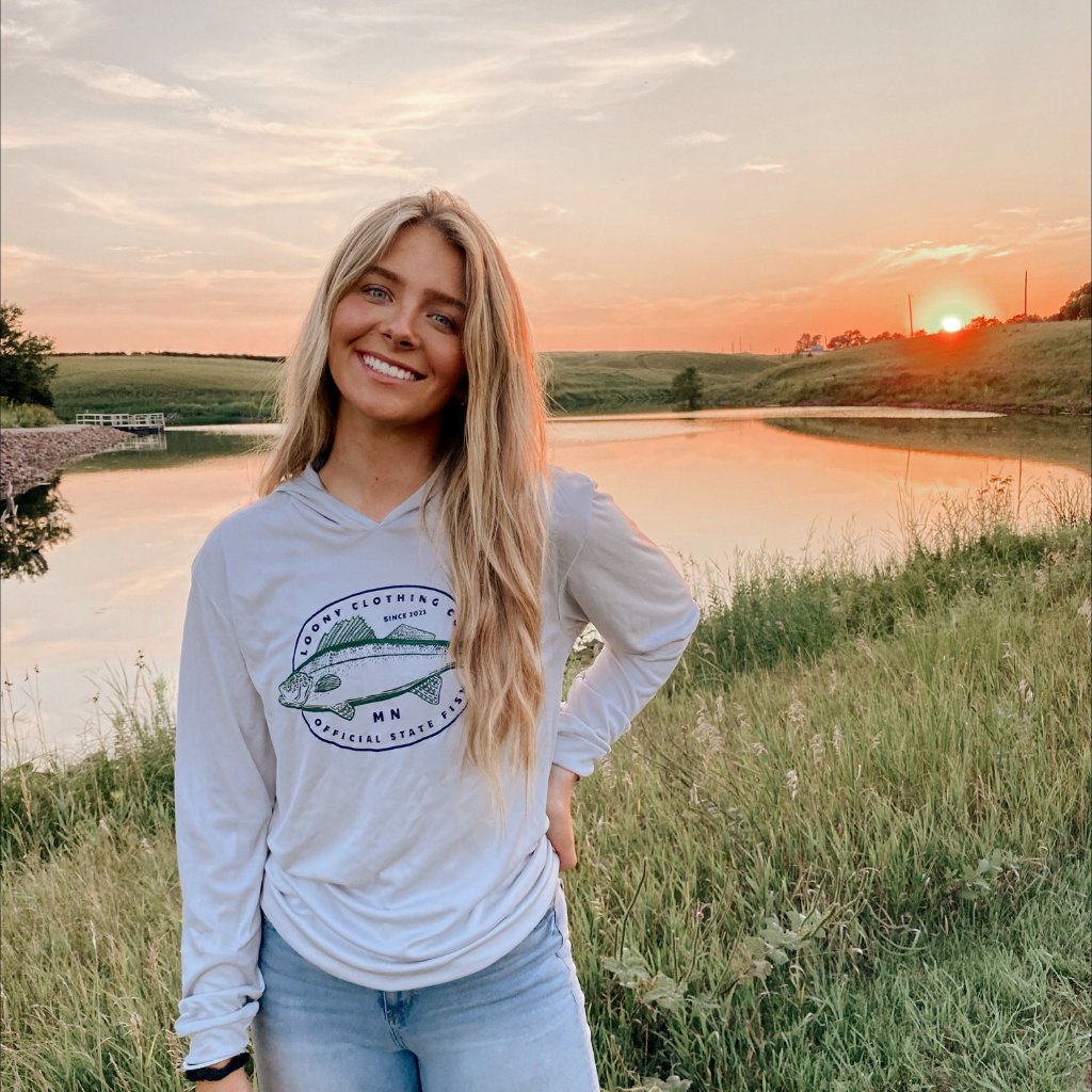 model wearing loony apparel with sunset
